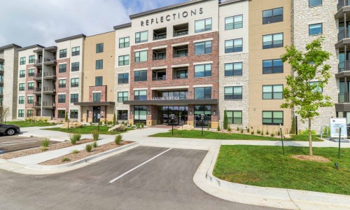 An exterior view of Reflections Apartments near Olathe, KS in Lenexa.
