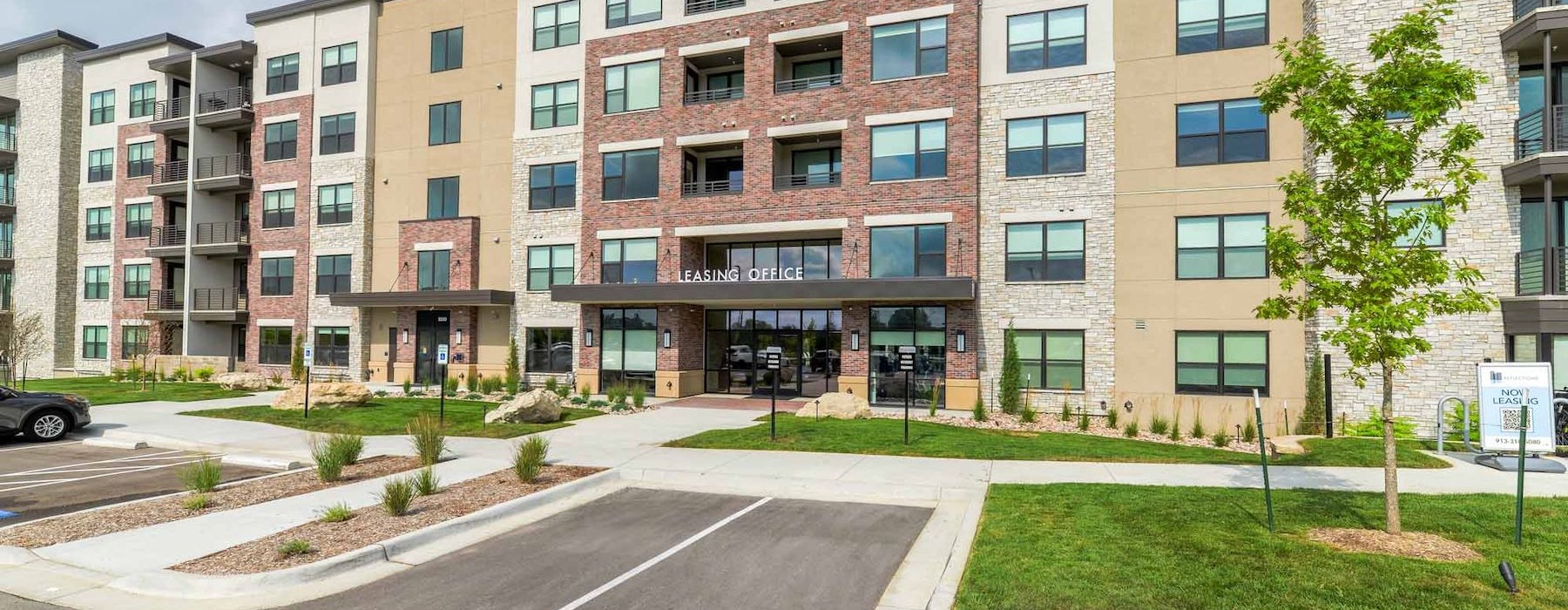 An exterior view of Reflections Apartments near Olathe, KS in Lenexa.